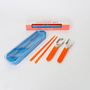 Orange cutlery set with blue case on a white background