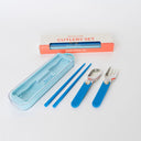 Set of cutlery with blue handles and a carrying case on a white background