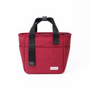 A red insulated lunch bag with a black fabric top handle zip up, leakproof | Spixal
