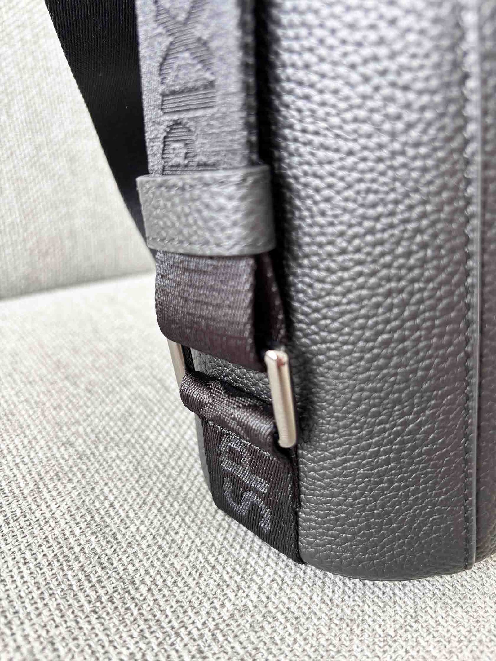 Black soft leather handbag webbing logo embossed strap