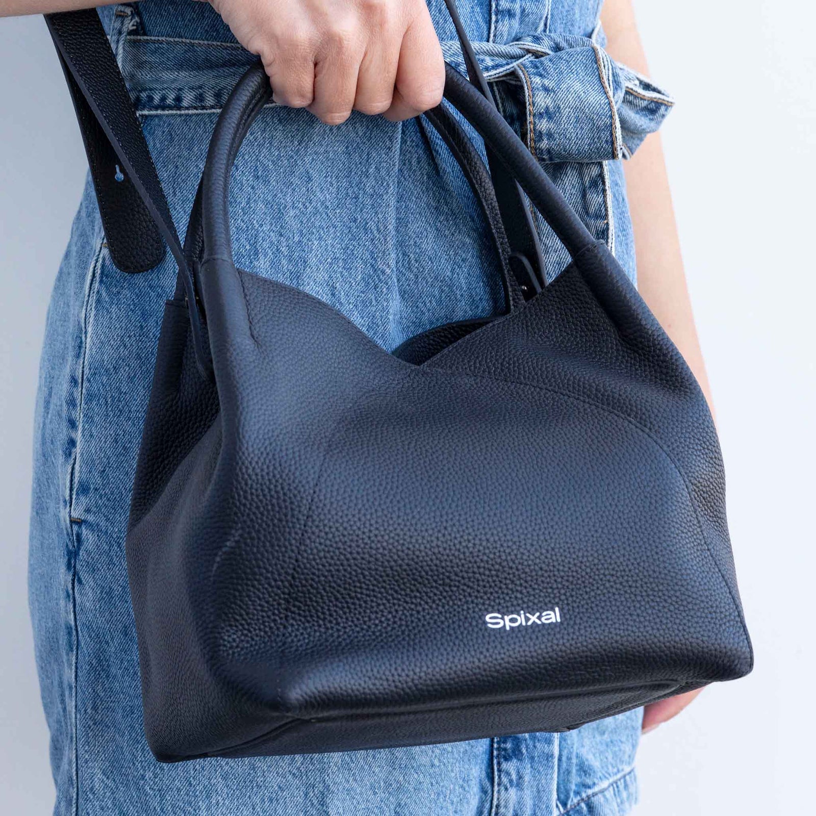 Shoulder carry handbag with dual zip access