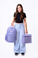 Large purple Axis school bag and homework folder carried by school girl matching set | Spixal
