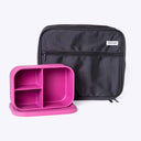 Pink silicone bento box lunch container with black lunch bag on a white background