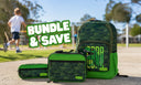 A green camouflage school bundle featuring a backpack, lunchbox, and pencil case, displayed on a paved path with a blurred background of children playing outdoors. A bold text overlay reads 'BUNDLE & SAVE'.