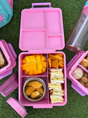Pink 4 compartment Bento Box with insulated food jar grass background | Spixal